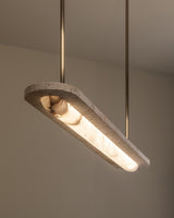 United Alabaster Capsa Pendant Light in natural alabaster with White Travertine ends and a satin gold brass structure