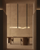 United Alabaster Signe linear pendant light in natural alabaster above a dining table