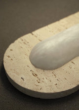 United Alabaster Capsa Wall Light in natural alabaster with White Travertine ends