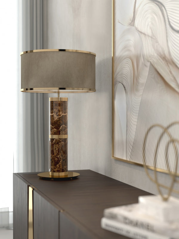 The Aurelian Light: Bespoke table lamp in marble with luxurious gold-plated brass rings. High-end designer lighting for luxury interiors.