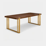 Berkeley Designs Winchester Dining Table, natural walnut veneer with open-frame brass legs, angled view