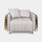 Boca do Lobo Imperfectio Armchair in cream upholstery with hand-hammered brass, available from Touched Interiors UK