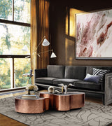Boca do Lobo Wave Center Table in copper in a contemporary living room