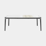 Luxxu Charla Outdoor Dining Table in a carbon powder coated frame, vintage teak and Calacatta Gold marble