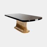 Castro Lighting Flusso Dining Table in polished brass with a marble top, available from Touched Interiors UK