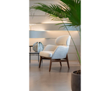 Celine Luxury Designer Armchair and Modern Curved Pouf styled in a luxury interior