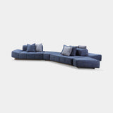 Ceriale Curved Modular Luxury Sofa in blue velvet on a metal plinth