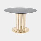 Castro Lighting Charlotte Dining Table in polished brass with a marble top, available from Touched Interiors UK