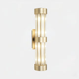 Castro Lighting Halma Tall Wall Light in gold-plated brass with clear glass, available from Touched Interiors UK
