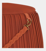 Jetclass Ribbon Pouf, detail of the fringe and plaited leather handle