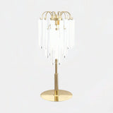 Castro Lighting Lotus Table Lamp in gold-plated brass with clear glass, available from Touched Interiors UK