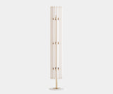 Mid-Century Modern Floor Lamp Design: White Metal with Gold Interior. The Lumière floor lamp by Mezzo Collection embodies the essence of mid-century modern design with a touch of luxury. This image highlights the lamp's key design elements: a sleek white metal exterior contrasting beautifully with the warmth of the gold-plated interior.