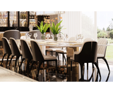 Sophisticated Luxxu dining table with Carrara marble and geometric brass detailing, perfect for modern decor