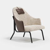 Marlowe Lounge Luxury Armchair: ivory bouclé seat with a brown leather outer shell (Cat B), black metal legs