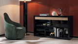 Medici swivel armchair in green leather in a living room