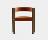 Mid-Century Modern Dining Chair: A Robust Addition to Your Dining Space. The Presidio Mid-Century Chair by Touched Interiors offers timeless design and modern comfort. This walnut wood chair features a robust build, inviting upholstery, and polished brass detailing, perfect for creating a stylish and comfortable dining experience.