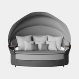 Luxxu Galea Grey Daybed in a carbon powder coated frame, Valencia Cement outdoor fabric and anthracite synthetic rope weave
