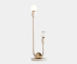 Skylab: Mid-Century Modern Floor Lamp in White Metal & Gold Brass. The Skylab floor lamp by Mezzo Collection embodies minimalist luxury. This exquisite piece features a single, curved white metal frame accented by a gleaming gold brass base, casting a warm and inviting glow in any modern living space. Inspired by the spirit of mid-century design, it creates a timeless statement piece.