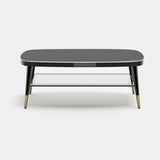 Whitby Elliptical Noir Glass Luxury Coffee Table: black gloss top with black legs and metal tips
