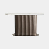 Luxury console table with channel quilted leather column base, marble top and titanium plinth