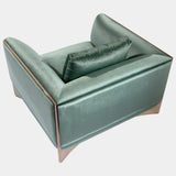 Luxury Modern Armchair: The Ca' Foscari Armchair by Visionnaire features a sleek, curved stainless steel base with a high-shine finish, contrasting beautifully with the soft upholstery. This modern statement piece is perfect for any high-end living space.