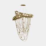Luxxu McQueen Chandelier in gold plated brass and amber crystal glass