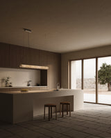 United Alabaster Roller Pendant Light above a kitchen island