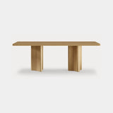 Dolmen Canyon Dining Table in natural oak, hand-carved scalloped base