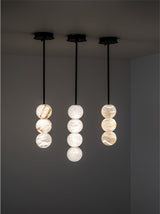 United Alabaster Raïm Pendant Light in natural alabaster with a matt black structure