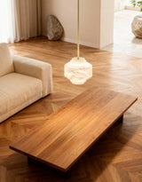 United Alabaster Cadaqués Cala Pendant Light above a coffee table