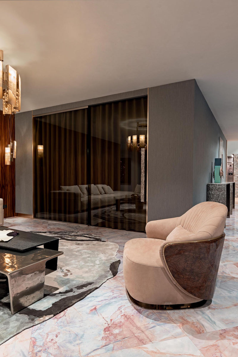 Unmatched Comfort Meets Visual Intrigue: The Adele Radica Armchair by Visionnaire. This exquisite variation features a stunning burr walnut backrest and plush upholstery for a luxurious seating experience.
