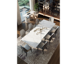 High-end dining table with Statuario marble top and brass details for luxury interiors
