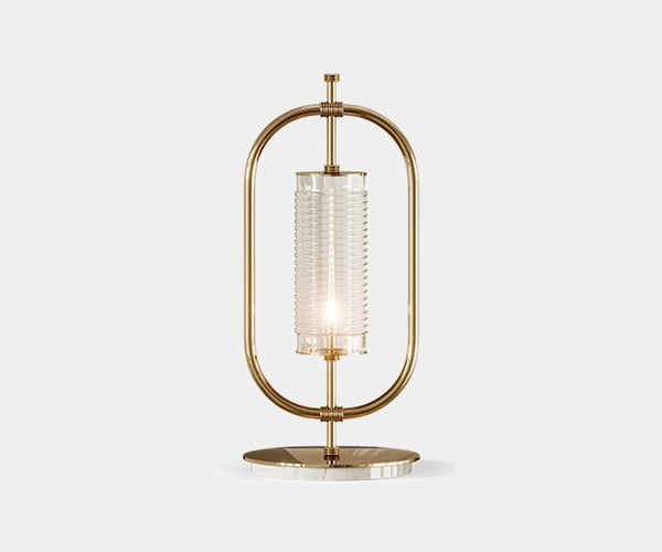  Beaumont: Minimalist Table Lamp in Gold-Plated Brass & Marble.  The Beaumont table lamp by Mezzo Collection embodies minimalist luxury.  This exquisite piece features a sleek oval frame in gold-plated brass and a Carrara marble base, casting a warm glow in any modern living space.