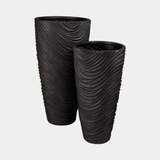 Bertarelli Curved Wave Luxury Floor Vase shown in black iron, pair in both heights