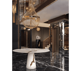 A Play of Light and Shadow: The Boca do Lobo Lapiaz White Dining Table - The Boca do Lobo Lapiaz White Dining Table showcases a captivating interplay of light and shadow on its lacquered mahogany surface accented with polished brass. This white iteration offers a modern interpretation of the brand's signature design.