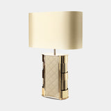 Castro Lighting Centurion Table Lamp in gold-plated brass with a fabric lampshade, available from Touched Interiors UK
