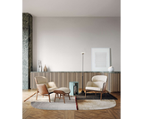 Celine Luxury Designer Armchair and Modern Curved Pouf styled in a luxury interior
