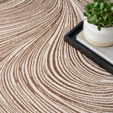 Central Park West Swirl Beige Brown Luxury Rug, available from Touched Interiors UK