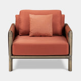 Doria Leather Clad Luxury Armchair in terracotta fabric with brown burnished brass