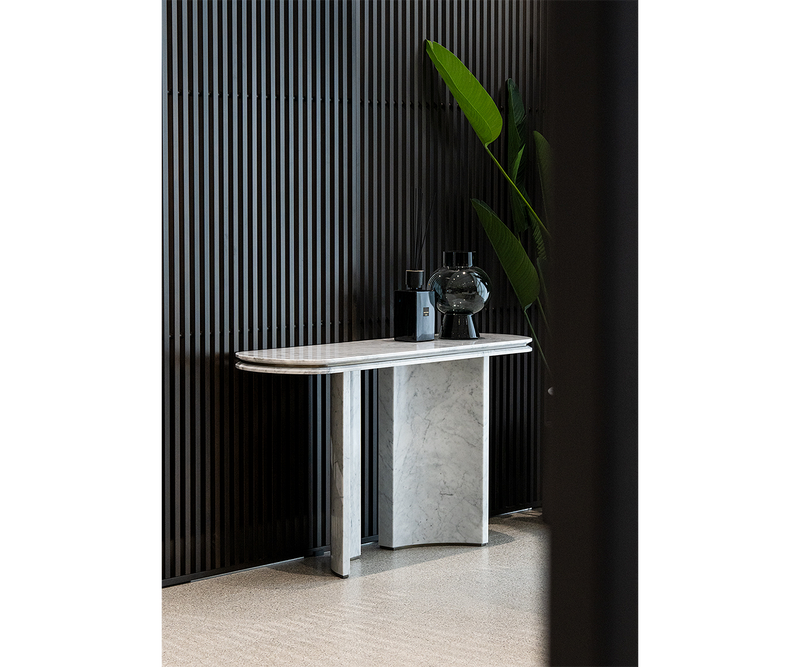 Ercole console table crafted from fine marble, highlighting sophisticated furniture craftsmanship.