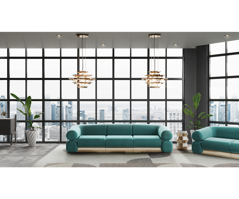 The Fitzgerald Sofa: A fusion of comfort and style. The rounded design and brass details create a luxurious and inviting statement piece.