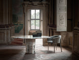 Flavianus Round Sculpted Marble Luxury Dining Table in a room setting