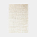 Hand-Woven Luxuriance Glam Rug in Perle, a soft ivory rug with a subtle sheen