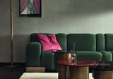 Massimo luxury sofa in green velvet on a burnished brass base in a contemporary living room