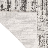 Irradiant Cream Black Luxury Rug, available from Touched Interiors UK