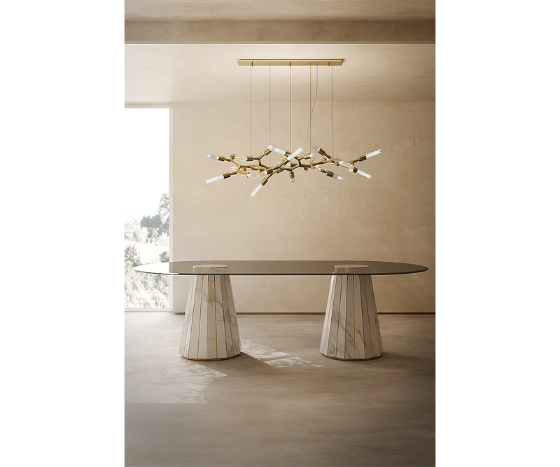 Luxxu Darian luxury dining table in walnut root, brass, and modern smoked glass