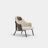 Marlowe Lounge Luxury Armchair: ivory bouclé seat with a brown leather outer shell (Cat B), black metal legs