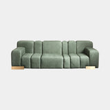 Massimo luxury modular sofa in green velvet with burnished brass feet
