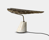 Contemporary table lamp with botanical design, perfect for living room decor.