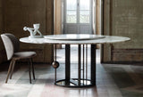 Nembo Sculptural Base Marble Luxury Dining Table in a room setting